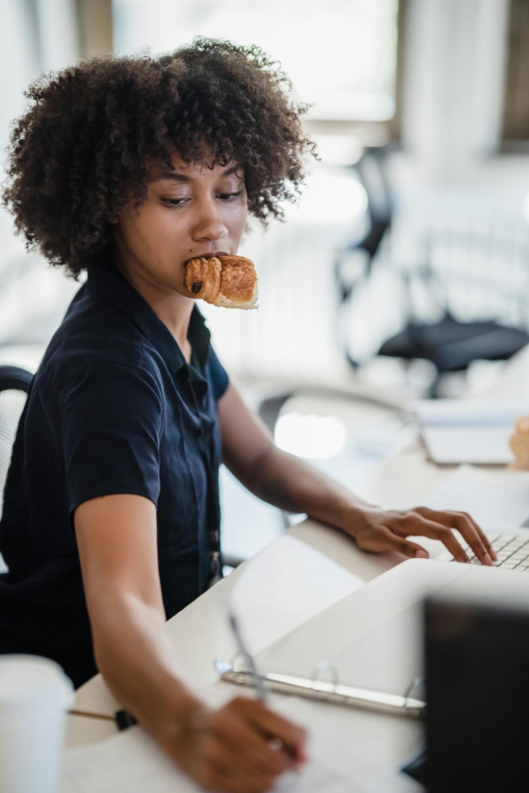 lady eating while working